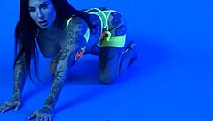 Petite busty milf Joanna Angel slips out of neon lingerie