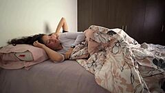 Latina lesbians snuggle in bed, groping asses and masturbating vaginas suggestively