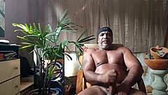 Brazilian bear Kojac solo masturbates his tattooed hairy monster cock