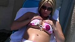 Paige Lotions Up Her Body Outdoors Under The Sunshine Intensely