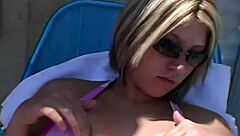 Paige Lotions Up Her Body Outdoors Under The Sunshine Intensely