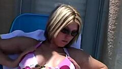 Paige Lotions Up Her Body Outdoors Under The Sunshine Intensely
