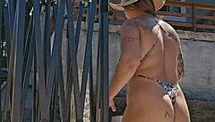 setting up tent in countryside with exhibitionist body in ass