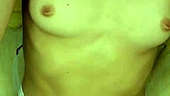 A girl in beautiful white lingerie caresses herself and fucks herself with a big pink dildo