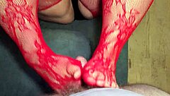 Chubby wife boldly gives footjob in red stockings to neighbor while husband travels.