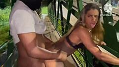 wife enjoys wild action with a fan on the light rail