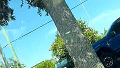 just a girl trying to adjust her sports bra in the gym parking lot before workout