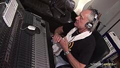 Busty brunette in stockings gets shaved pussy fucked doggystyle and cowgirl in MMF threesome on sofa