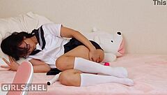 Asian student uses toys to make herself cum while skipping homework in bedroom.