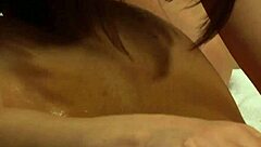 Oiled mistress dominates bound slave with sensual massage leading to intense orgasm.