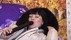 can you picture a mature milf sucking a big dildo in different positions with fur trim hood