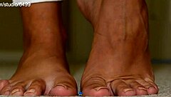 giant sexy woman squeezing and crushing small toys with feet in femdom fetish