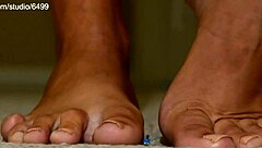 giant sexy woman squeezing and crushing small toys with feet in femdom fetish