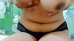 Beautiful Indian girl enjoying fingering in her bedroom.