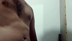 Skinny young amateur undresses for intense solo masturbation in the bathroom