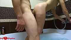 Conversational-Neutral taking a refreshing shower in the bathroom with wet soapy bath