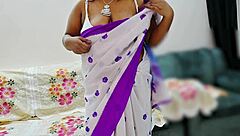 Indian Beauty Poses Elegantly In Traditional Saree With Graceful Charm