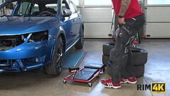 Intriguing dame with big boobs licks anus in car repair shop