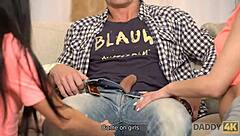 handsome man contrasts with two dazzling teens in a relaxing living room ffm threesome with blowjobs