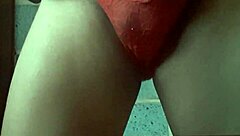 she models her wife's panties in a teasing display before slipping them off for a close-up view