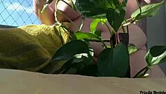 flashing big natural tits outdoors while watering plants naked for public exhibition