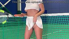 a blonde on a tennis court