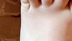 Brunette milf greta applies nail polish to her toenails in homemade amateur video