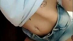 Watch this naughty babe flaunt her huge clit and hairy pussy in tight jeans shorts - no panties!