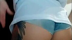 Watch this naughty babe flaunt her huge clit and hairy pussy in tight jeans shorts - no panties!