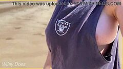 wife enjoys a relaxing walk around the public beach without clothes