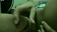 Curly-haired Brazilian housewife indulges in solo masturbation, using a dildo on her tight shaved pussy until orgasm.