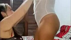 Two curvy Colombian lesbians dive into intense foreplay humping big natural tits and asses together