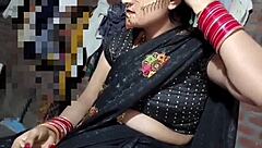 Hey, check out this Indian beauty in black saree pissing outdoors