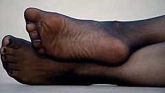 Exciting feet display in sleek nylon pantyhose!
