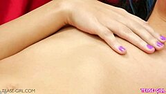 Sexy brunette teen with perfect body poses seductively on sofa during casting