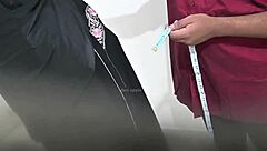 doctor performs routine check on hijab lady in hospital