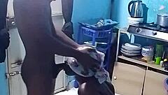 African amateur bends over in kitchen revealing big pussy lips and wet ebony slit