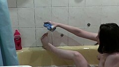 hey check this cute naked girl getting soapy foam all over her wet pussy boobs and ass