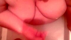 chubby wife kneels naked for hot cum on big tits tub