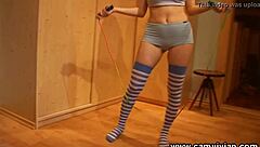 redhead babe's big tits bounce topless with rope