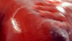 Ebony soapy natural tits glistening wet and bouncy