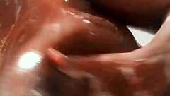 Ebony soapy natural tits glistening wet and bouncy