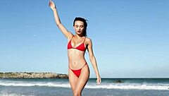 Gorgeous brunette gloria sol strips horny on beach