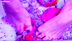 bare toes smash juicy fruit so close up
