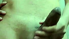 Skinny guy strokes huge cock in work bathroom solo