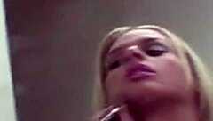 Rubia putita prostitute applies makeup seductively