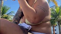 Horny beach exhibitionist flashes big pussy for guys