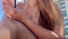 Horny beach exhibitionist flashes big pussy for guys