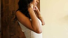 Glamcore babe strips on sofa seductively