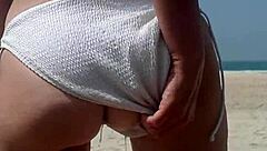 fat ass pees white bikini on crowded public beach!